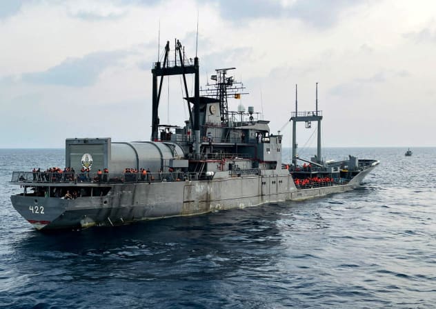 A Sri Lanka Navy vessel approaches an Iranian Navy vessel IRIS Bushehr (422) during a rescue operation, a day after the crew of a distressed Iranian military ship, IRIS Dena, were assisted in waters south of Sri Lanka, off the coast of Colombo, Sri Lanka, March 5, 2026.