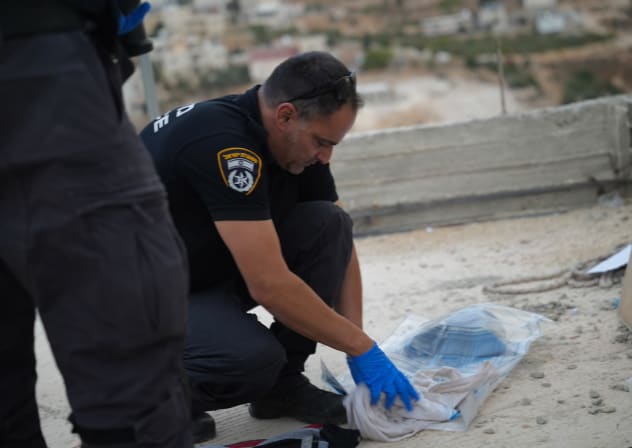 Israel Police collect evidence after finding the body of an east Jerusalem man near the West Bank city of Bethlehem on October 26, 2026.