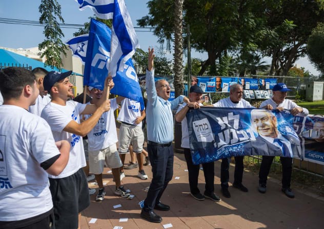Election campaign posters are seen outside a polling station in Ashdod during Election Day, October 27, 2026.