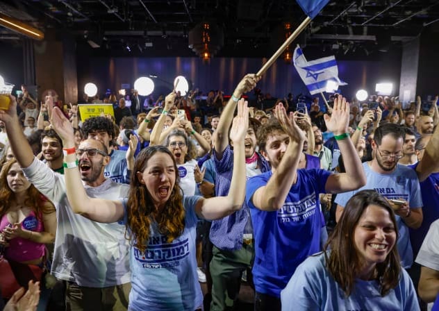 Supporters celebrate at the Democrats party’s election headquarters in Tel Aviv, following the release of exit poll results on Israel’s general election night, October 27, 2026. 