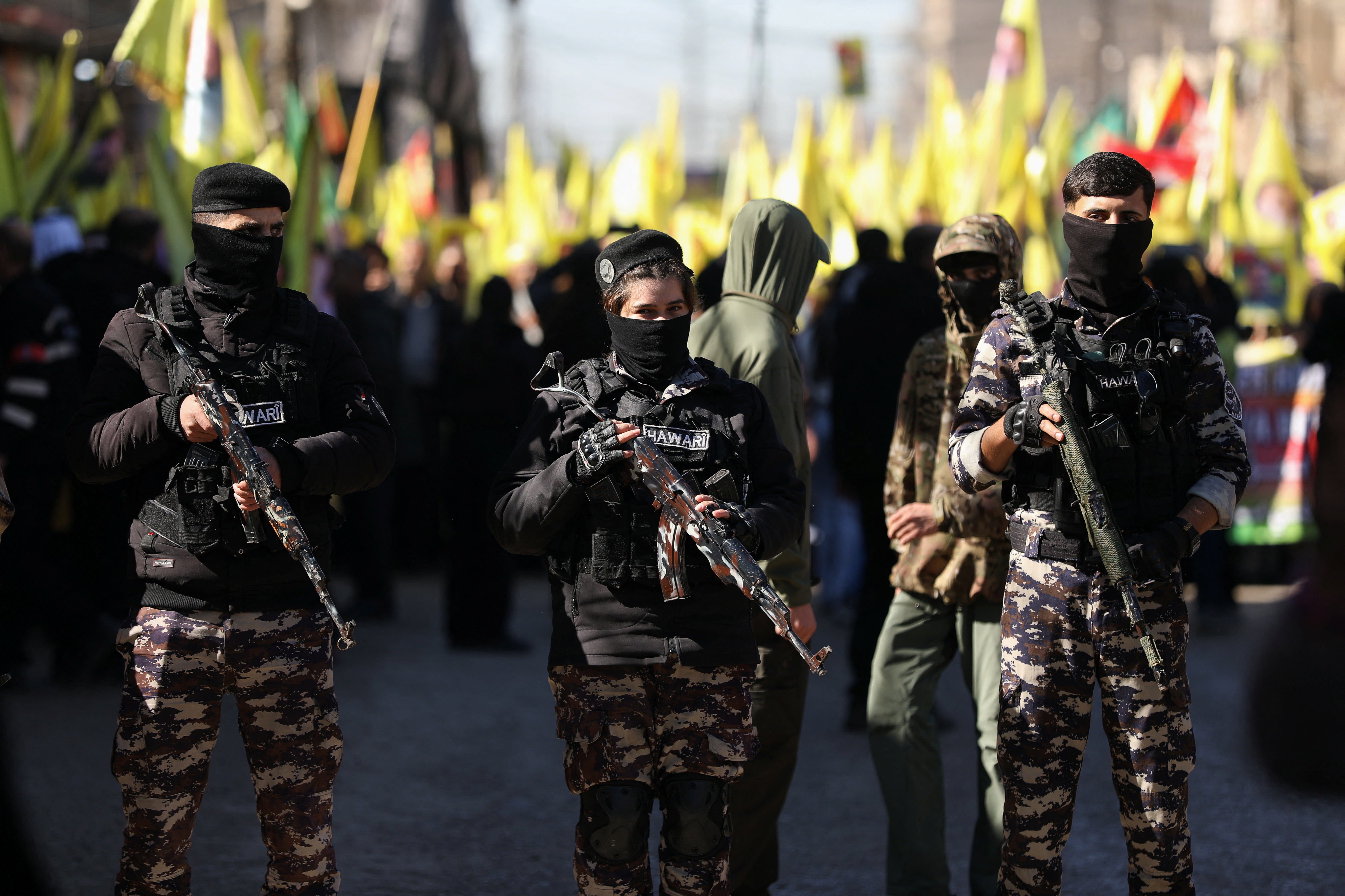 Kurdish internal security forces stand guard, as Syrian Kurds demonstrate to demand the release of Kurdish militant leader Abdullah Ocalan, who has been held in prison by Turkey since his capture in 1999, in Qamishli, Syria February 15, 2026. (photo credit: REUTERS/Orhan Qereman)