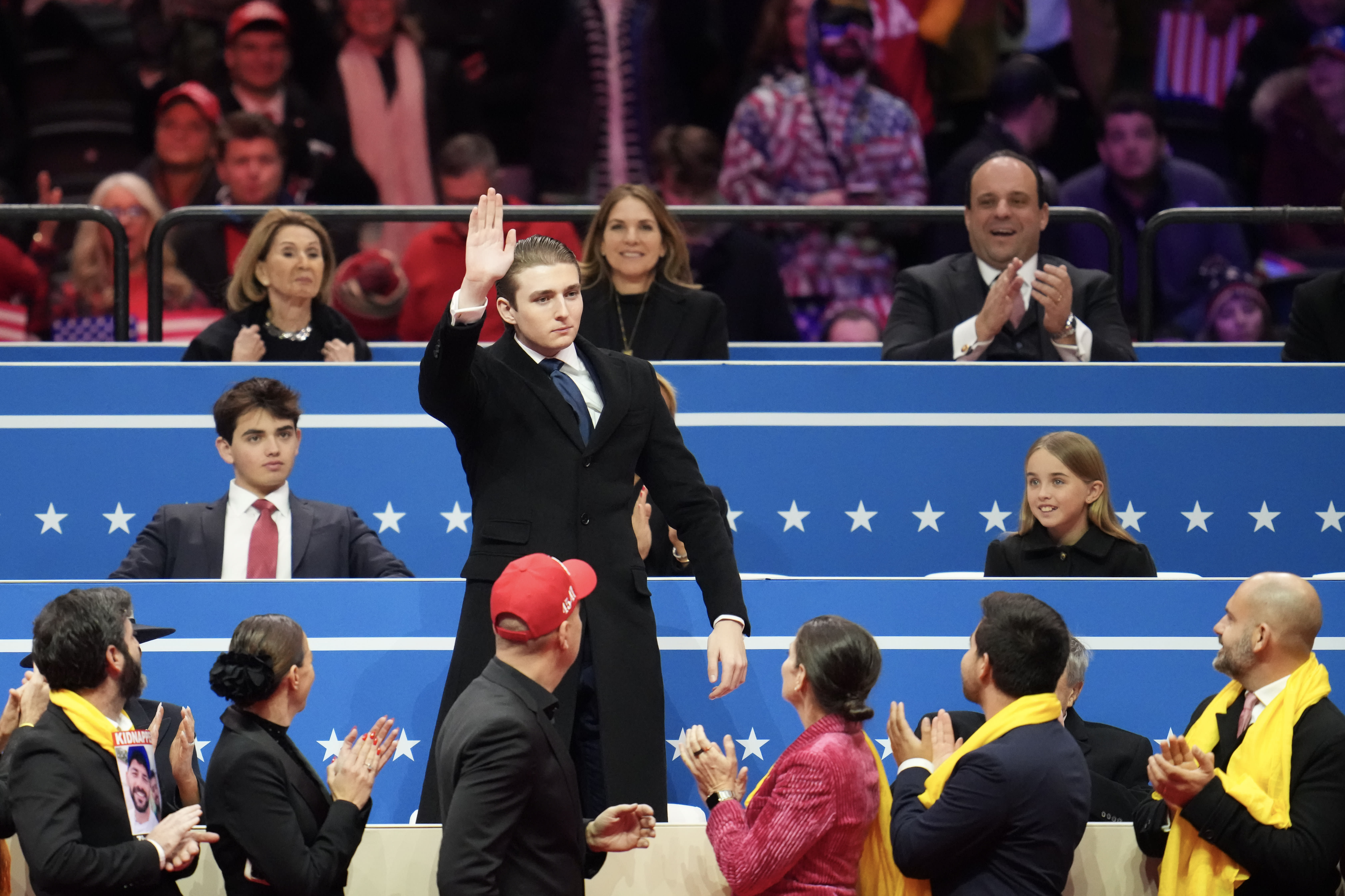 Barron Trump gestures as he is recognized during an indoor inauguration parade at Capital One Arena on January 20, 2025 in Washington, DC. Donald Trump takes office for his second term as the 47th president of the United States.  (photo credit: Christopher Furlong/Getty Images)