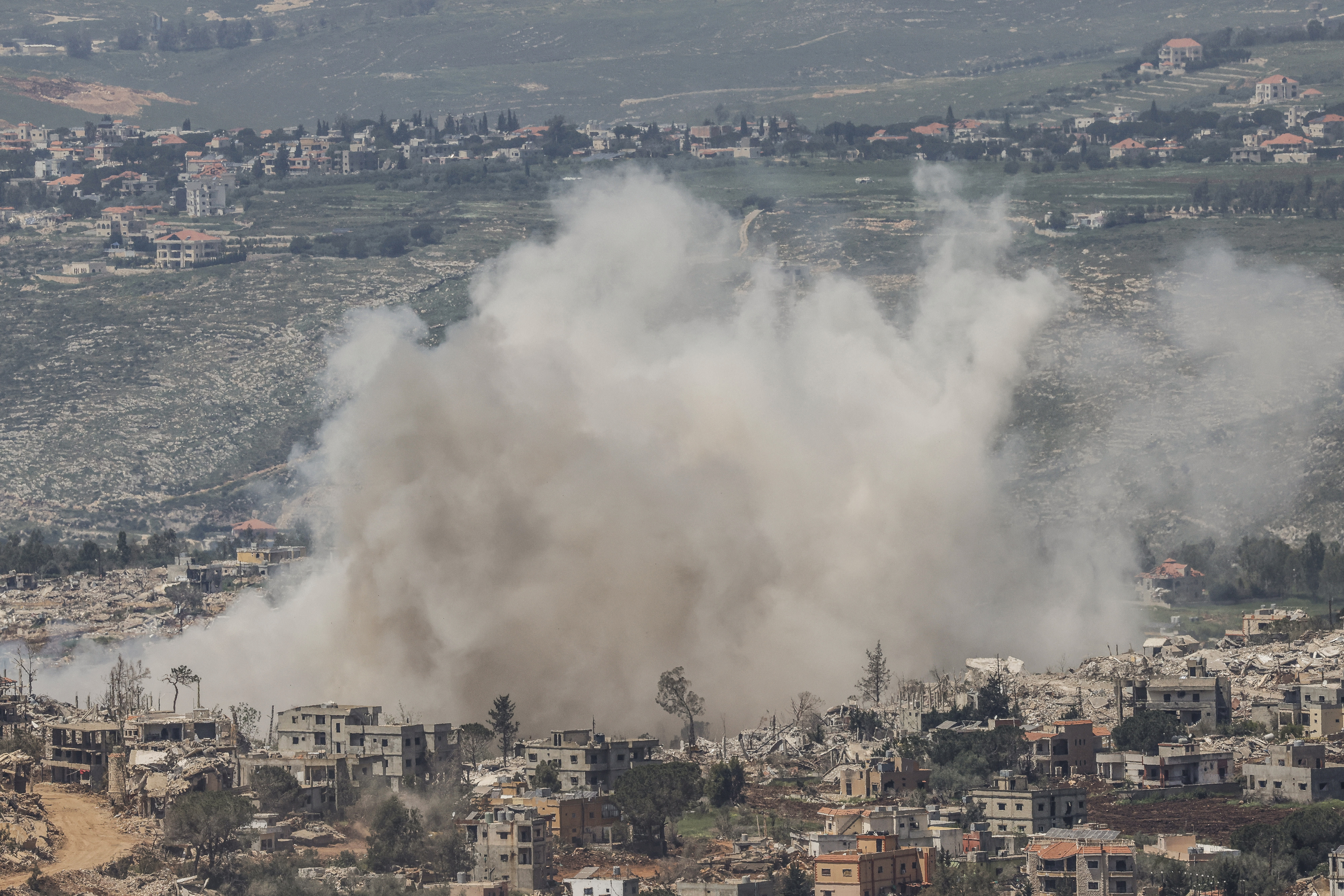 Smoke rises as the IDF strikes targets in southern Lebanon near the border as seen from the Upper Galilee in northern Israel on April 27, 2026. (photo credit: Jalaa MAREY / AFP via Getty Images)