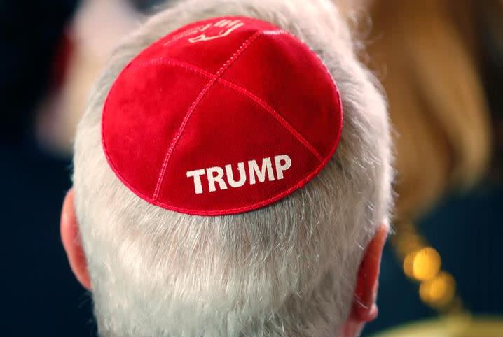 A man wears a Trump yarmulke while waiting for U.S. President Donald Trump to address the Republican Jewish Coalition 2019 Annual Leadership Meeting in Las Vegas, Nevada, U.S., April 6, 2019. (photo credit: KEVIN LAMARQUE/REUTERS)