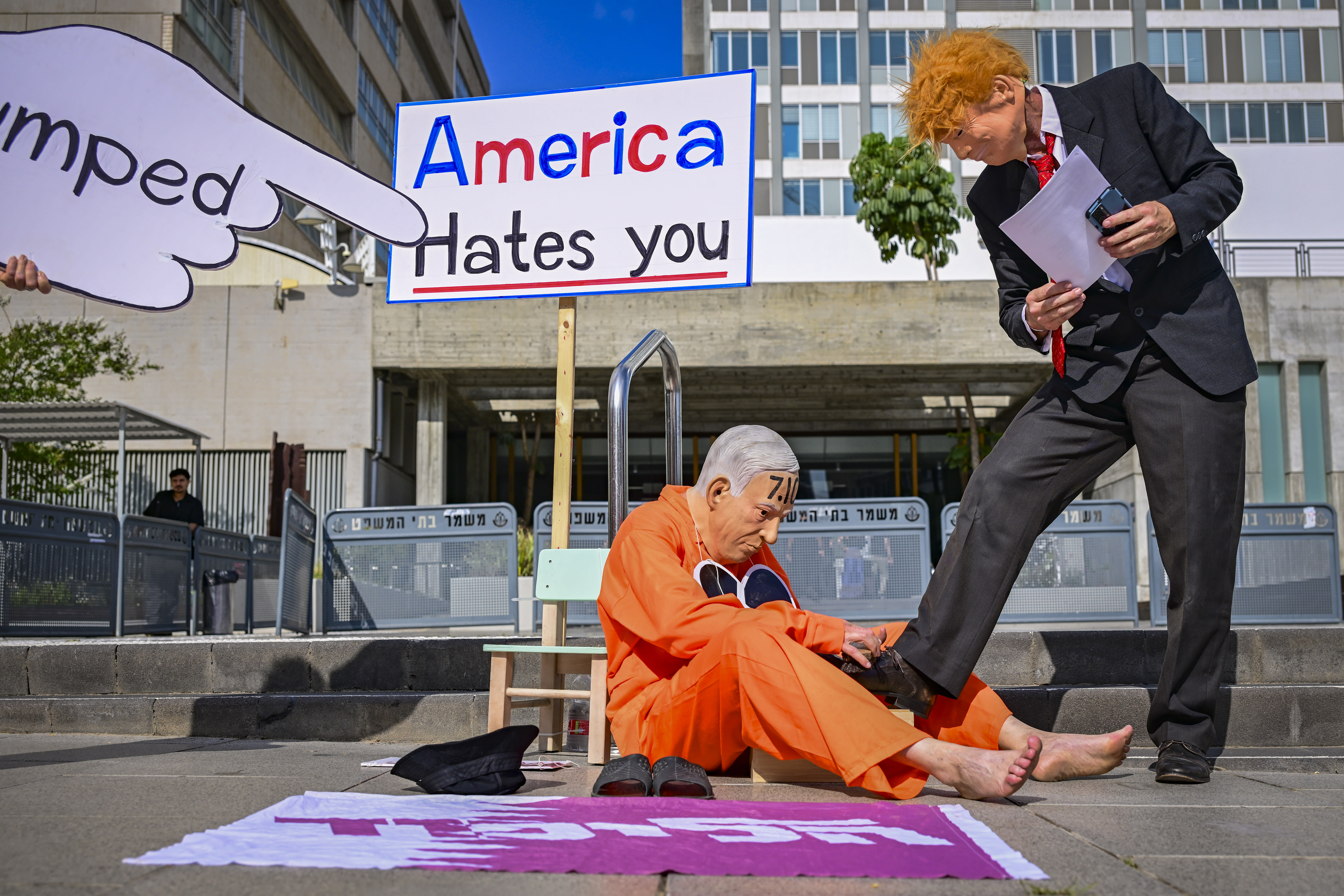 ACTIVISTS PROTEST against Prime Minister Benjamin Netanyahu and his government outside the District Court in Tel Aviv, on June 16, 2026. (photo credit: AVSHALOM SASSONI/FLASH90)