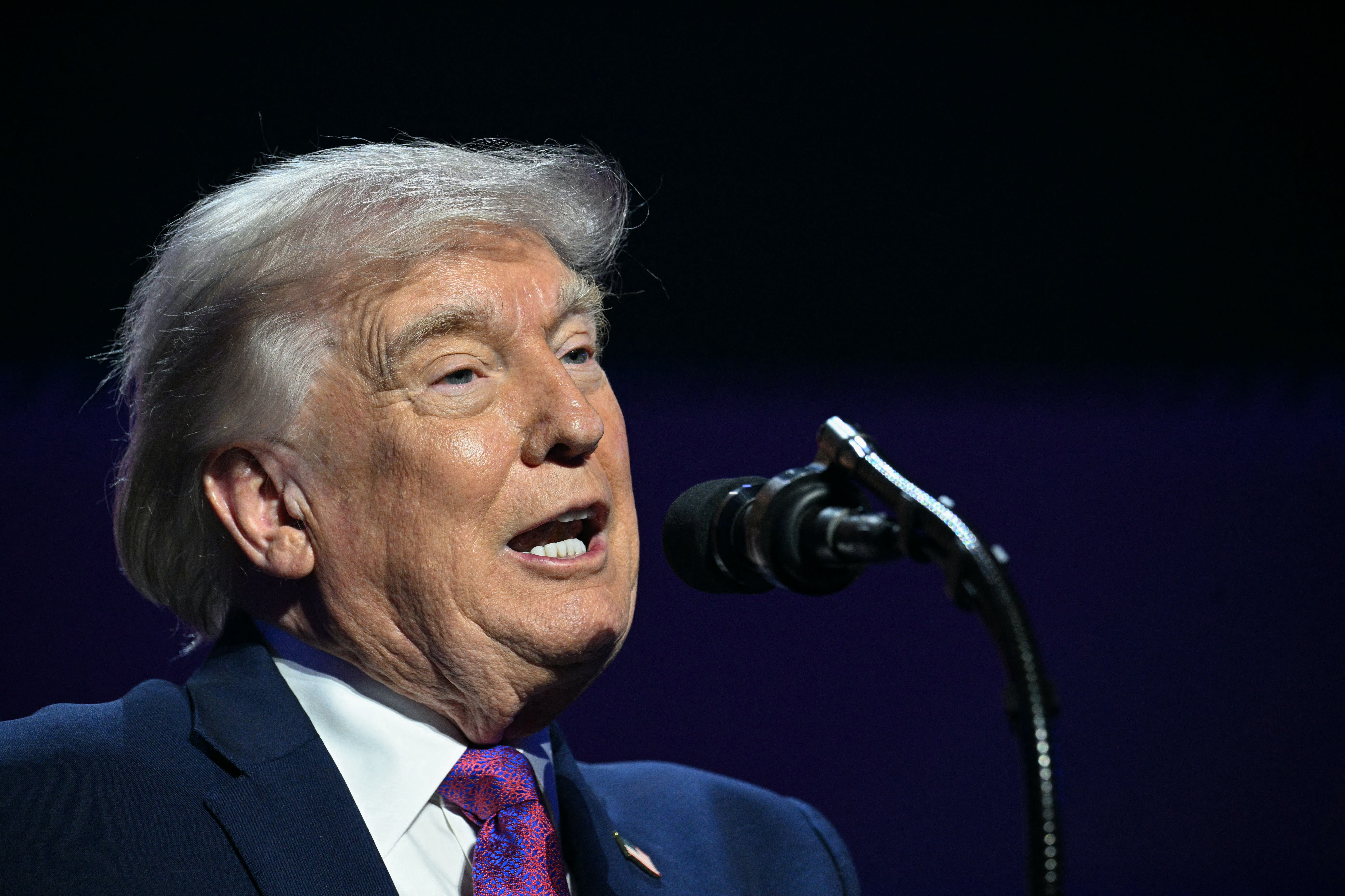US President Donald Trump addresses a Turning Point USA event entitled "Build the Red Wall" at Dream City Church in Phoenix, Arizona, on April 17, 2026. (photo credit: Jim WATSON / AFP via Getty Images)