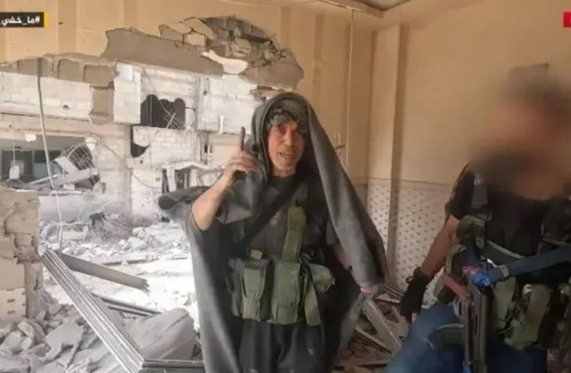 Yahya Sinwar walks through Gaza ruins.