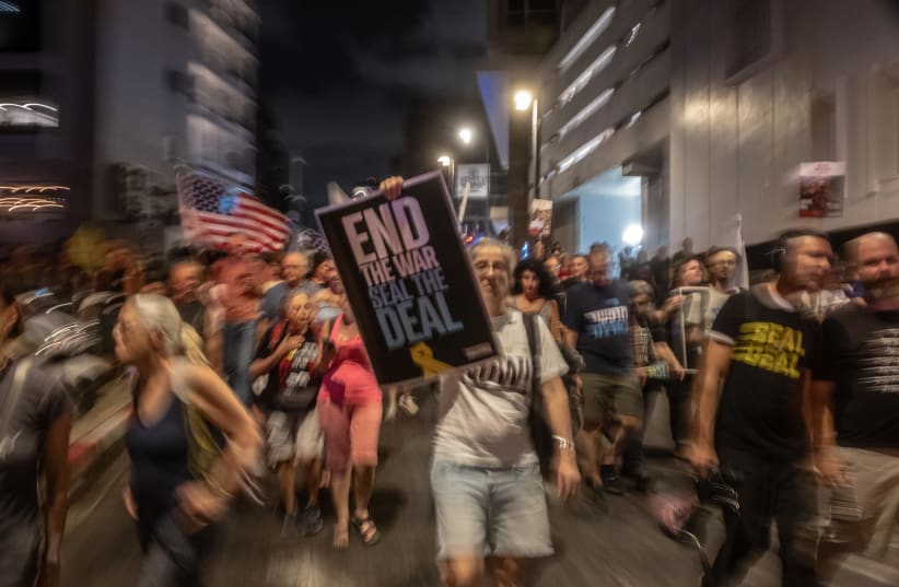  Israelis demonstrate in Tel Aviv in support of a hostage, ceasefire deal, July 19, 2025.