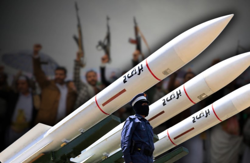 Houthi soldiers stand guard on a missile carrier during an official military parade marking the ninth anniversary of the Houthi takeover of the capital, Sanaa, on September 21, 2023. (photo credit: Getty Images/MOHAMMED HUWAIS/AFP)