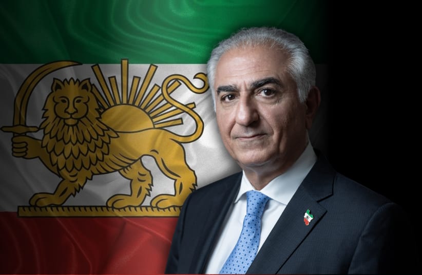 Iran’s Crown Prince Reza Pahlavi, with the Iranian, Lion and Sun flag. 