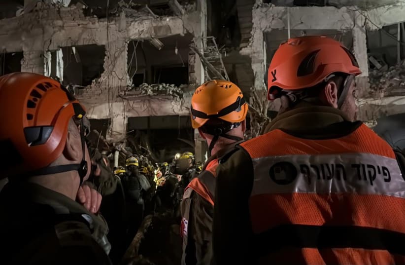 IDF SEARCH and Rescue Unit operates at a building hit by an Iranian missile.