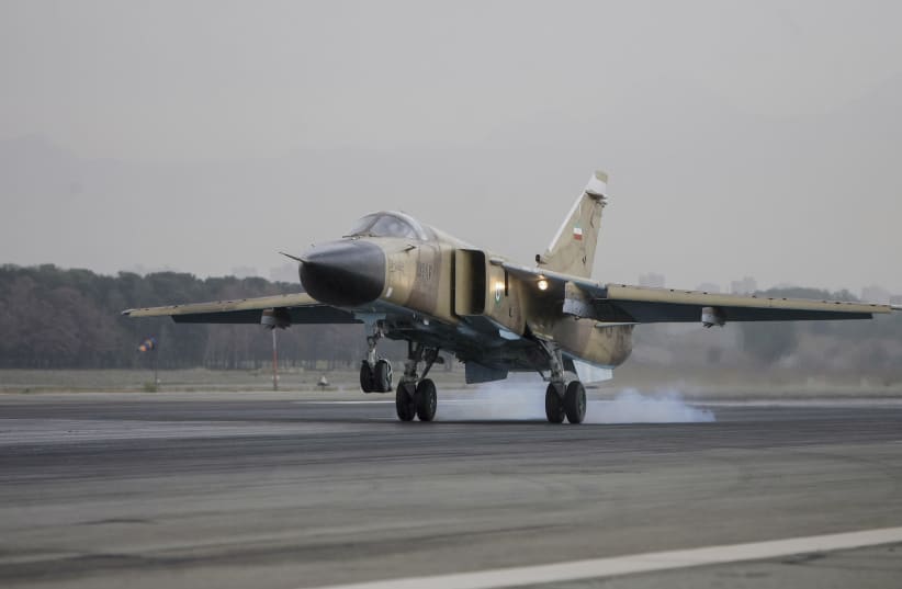 A Sukhoi Su-24M Fencer D aircraft lands on the runway during an Islamic Republic of Iran Air Force military drill at the Shahid Lashkari Tactical Air Base (TAB-1) in Tehran, Iran, on April 16, 2009 (photo credit: Ali Rafiei/Middle East Images/AFP via Getty Images)
