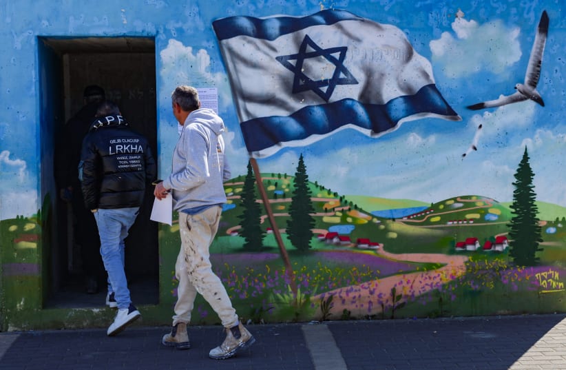 Israelis take cover in a public shelter in the northern Israeli city of Safed as a siren sounds warning of incoming missiles fired into Israel, March 10, 2026 (photo credit: David Cohen/Flash90)