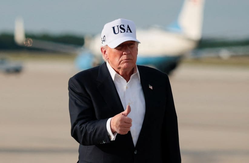 US President Donald Trump gives a thumbs up after disembarking Air Force One following his trip to China at Joint Base Andrews, Maryland, US, May 15, 2026.