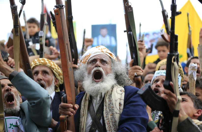 Supporters of the Iran-backed Houthi movement brandish their weapons as they rally in solidarity with Iran and Lebanon amid the Middle East war, in the capital Sanaa on April 17, 2026. 