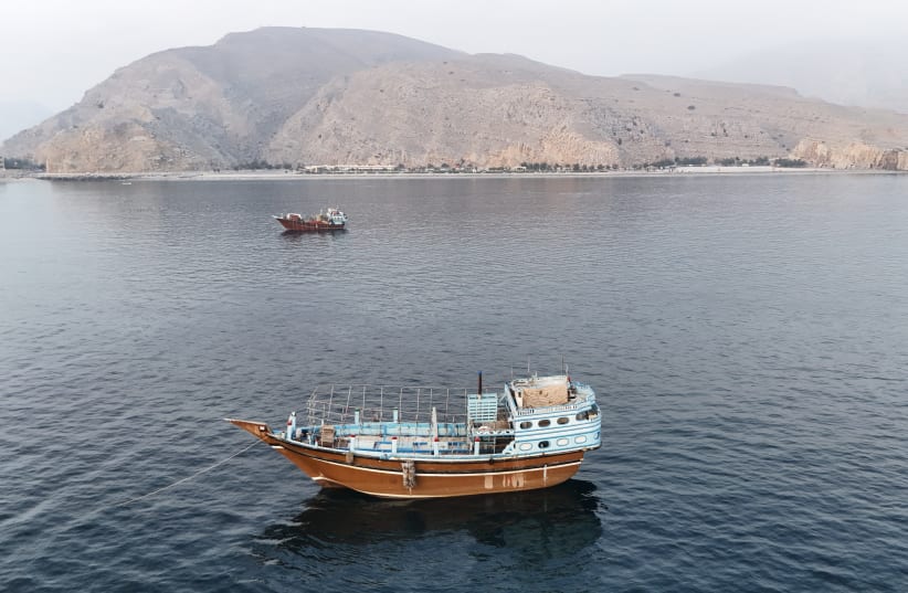 This aerial photograph shows boats anchored off Oman's northern Musandam Peninsula near the Strait of Hormuz on June 27, 2026.