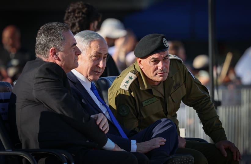 (L-R) Defense Minister Israel Katz, Prime Minister Benjamin Netanyahu, and IDF chief Eyal Zmair attend an IDF officers’ course graduation ceremony in southern Israel, June 25, 2026