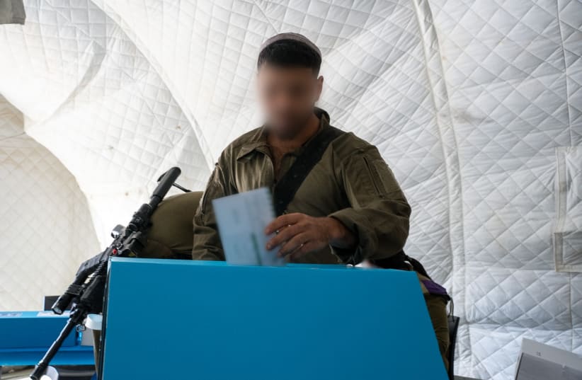An IDF soldier votes at a military polling station ahead of the October 27 Knesset elections.