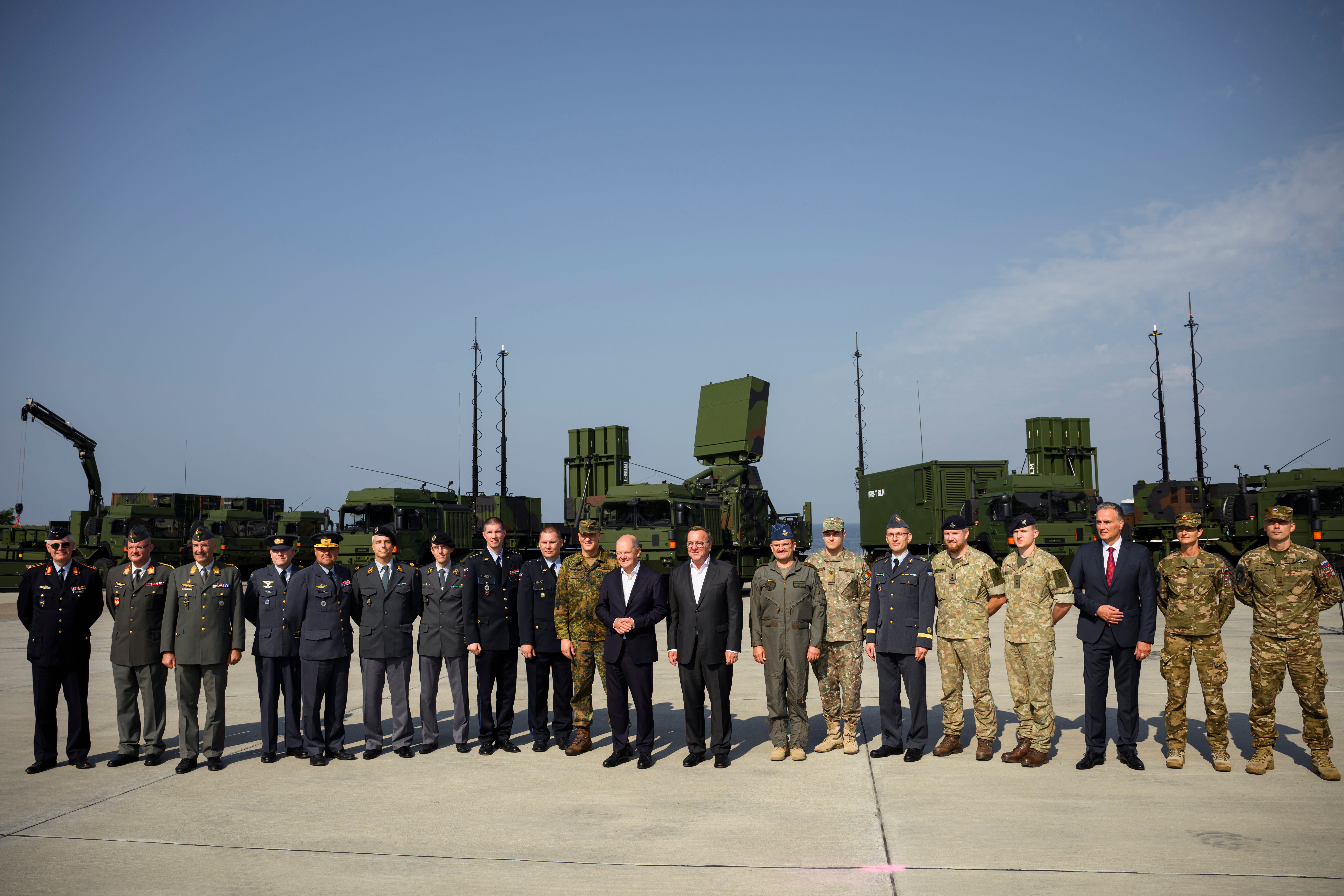 German Chancellor Olaf Scholz and Defence Minister Boris Pistorius take a group photo with representatives of members of the military initiative sky shield during the operative launch of the Bundeswehr