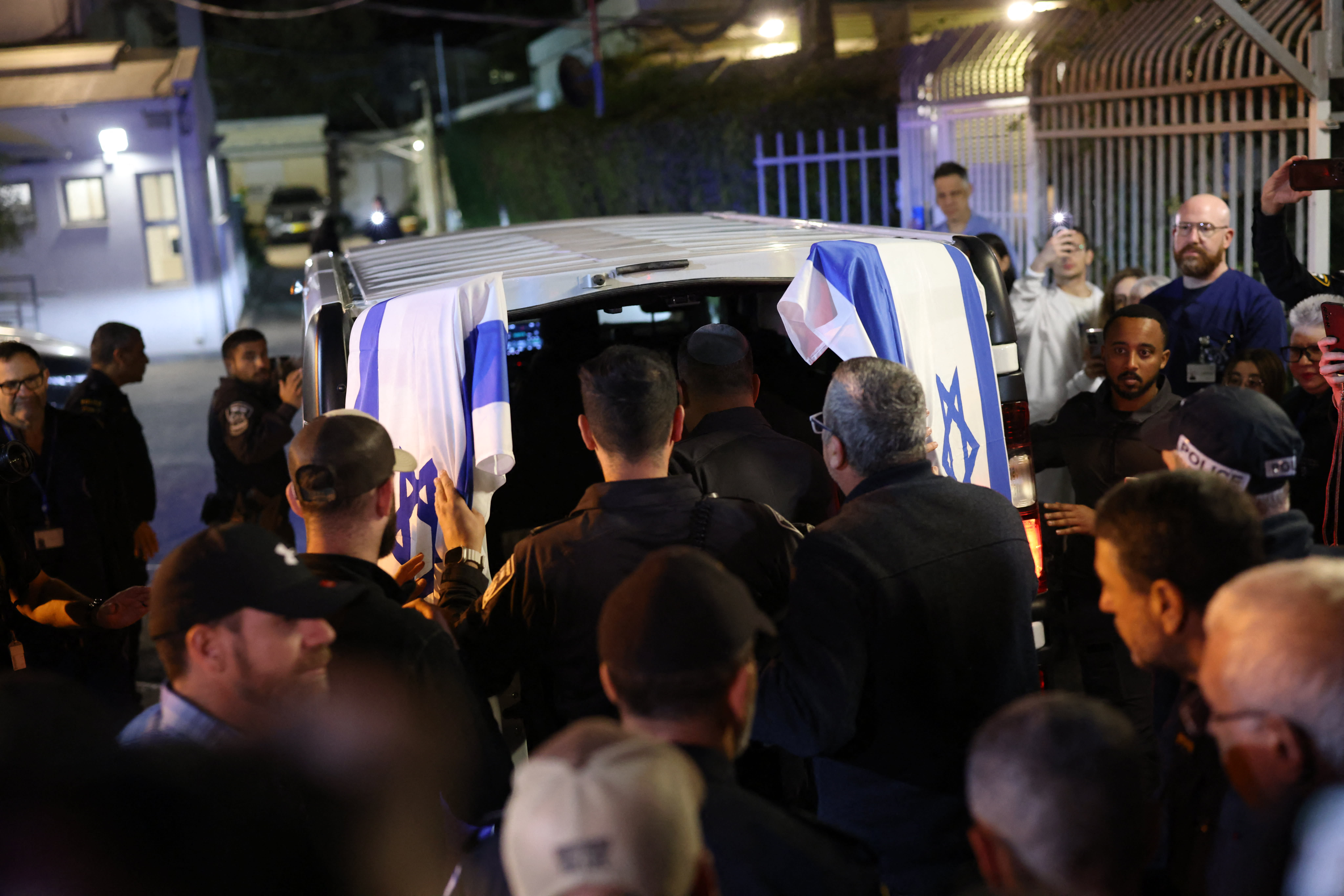 Israeli police officers pay their respects outside of the Abu Kabir Forensic Institute, as the body of last Israeli hostage arrives in Tel Aviv on January 26, 2026.  (photo credit:  ILIA YEFIMOVICH / AFP via Getty Images)