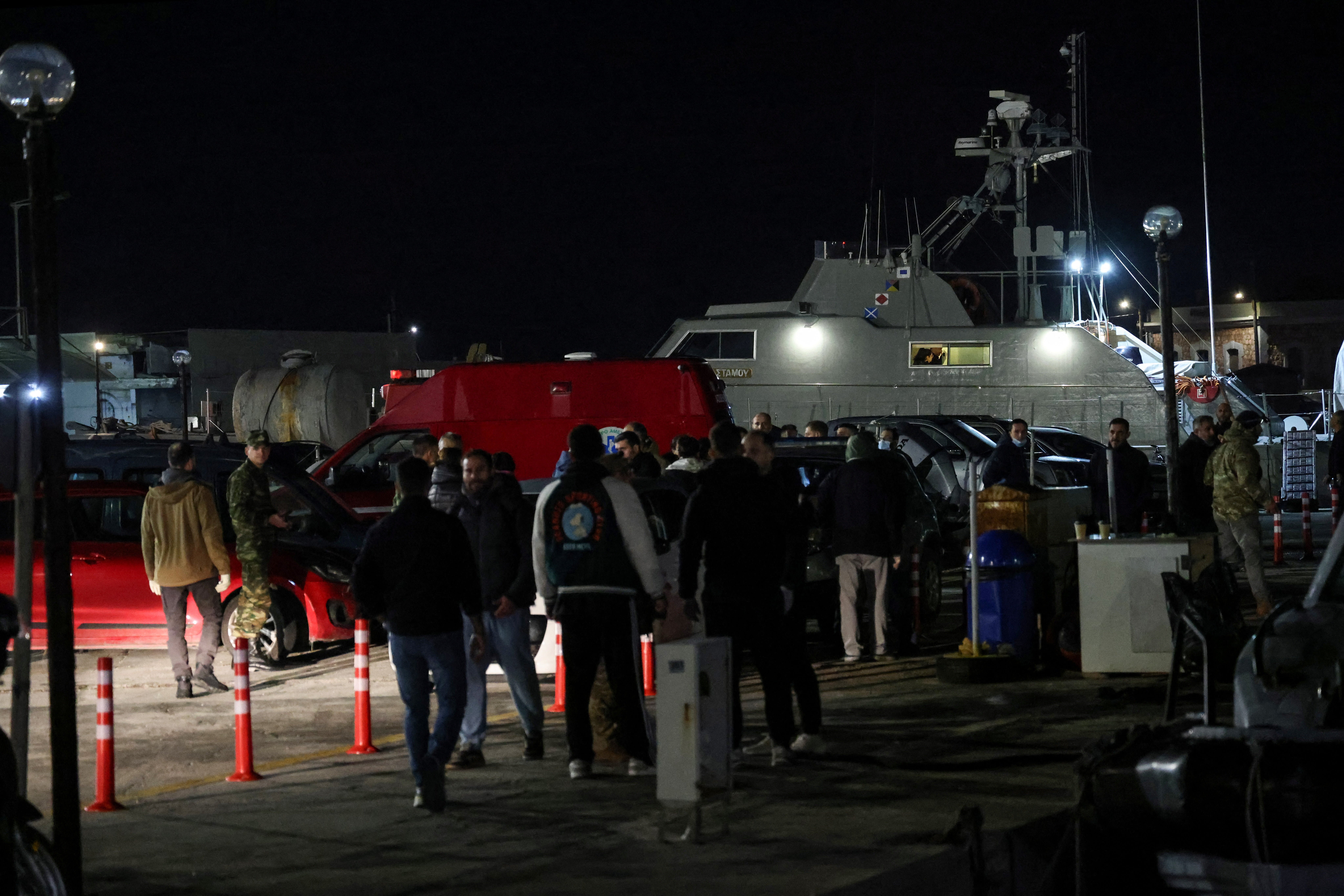 Greek emergency personnel wait to transfer bodies of dead migrants, following migrant’s boat collision with coast guard off the island of Chios, in the port of Chios, Greece, February 3, 2026.  (photo credit:  REUTERS/Konstantinos Anagnostou)