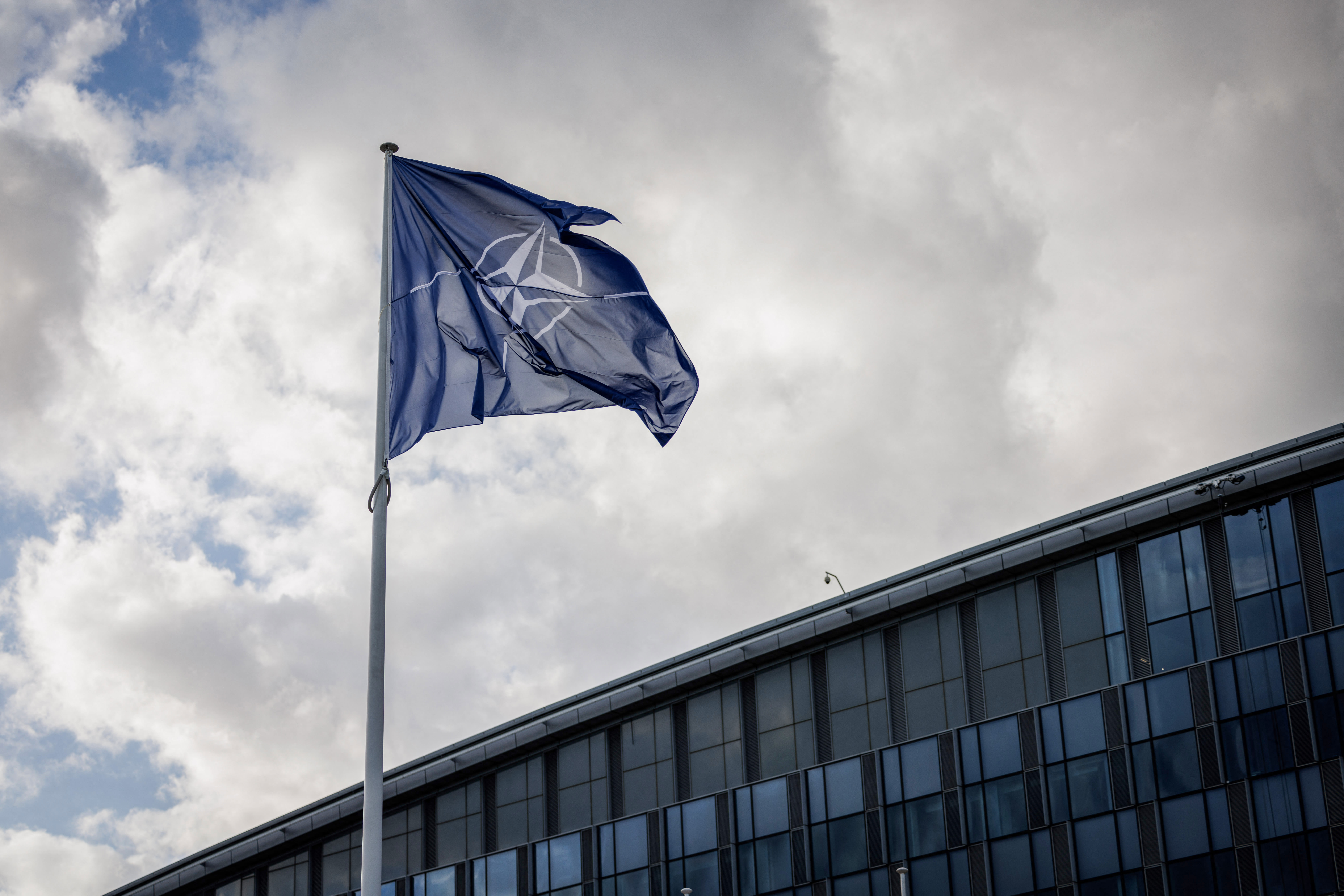A NATO flag flies at the NATO headquarters in Brussels on September 12, 2025. (photo credit:  SIMON WOHLFAHRT/AFP via Getty Images)