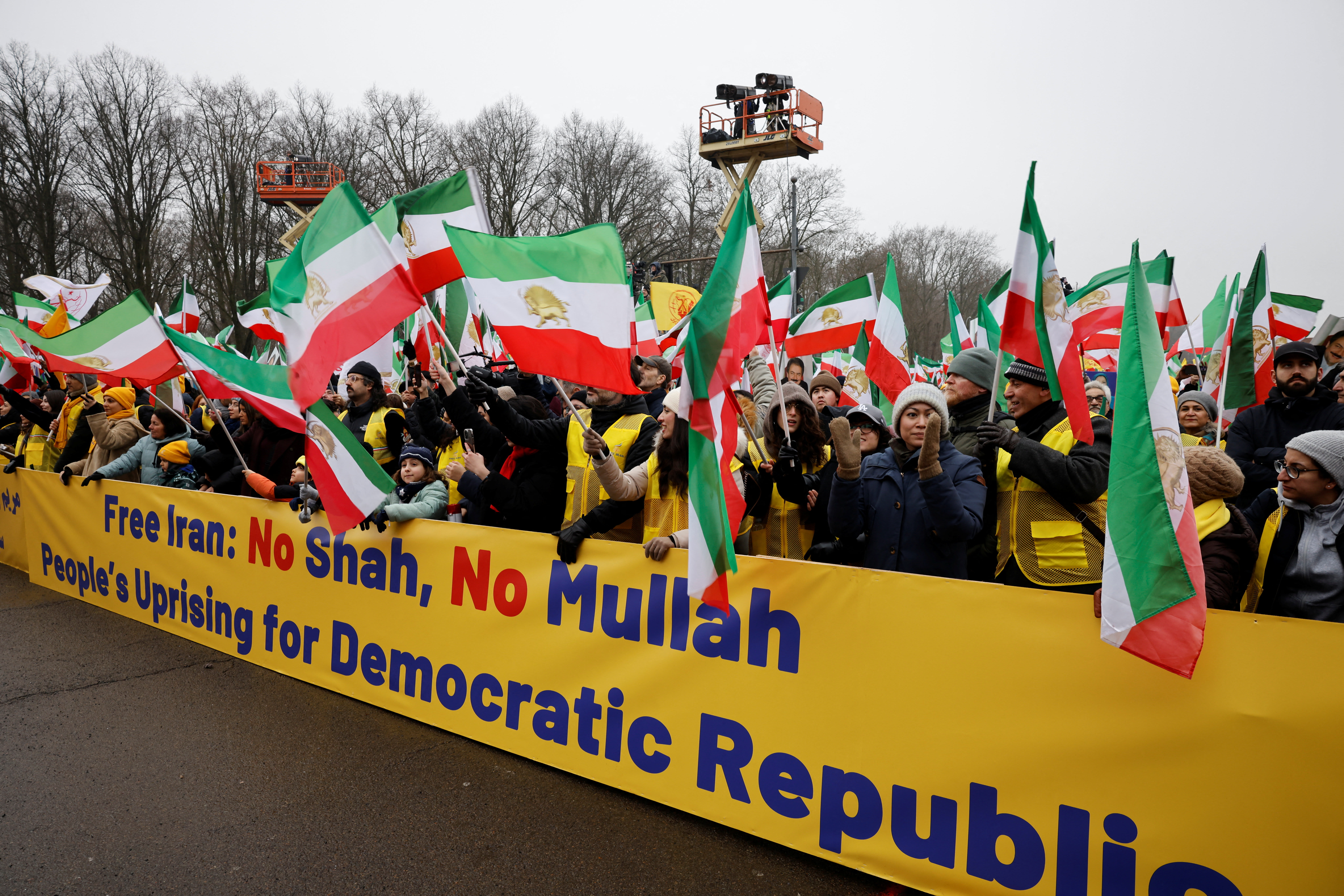 People carry a banner, as supporters of the Iranian opposition group, the National Council of Resistance of Iran, protest to demand an immediate stop to the violence against protesters in Iran and an end to detentions and repression, in Berlin, Germany, February 7, 2026 (photo credit: REUTERS/AXEL SCHMIDT)