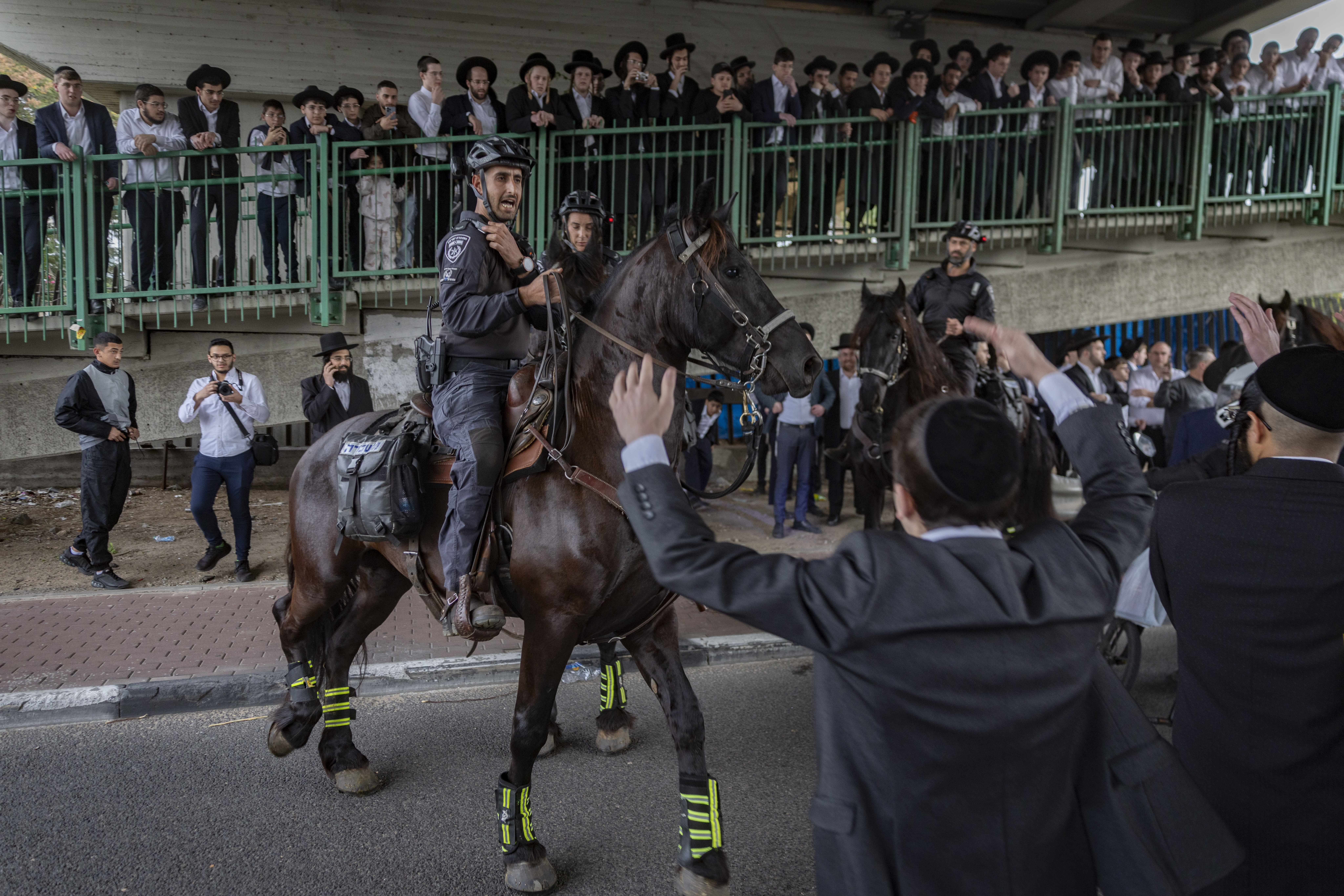 Ultra-Orthodox men block a road during a protest against the jailing of seminary students who failed to comply with the IDF draft, in Jerusalem, in February. (photo credit: CHAIM GOLDBERG/FLASH90)