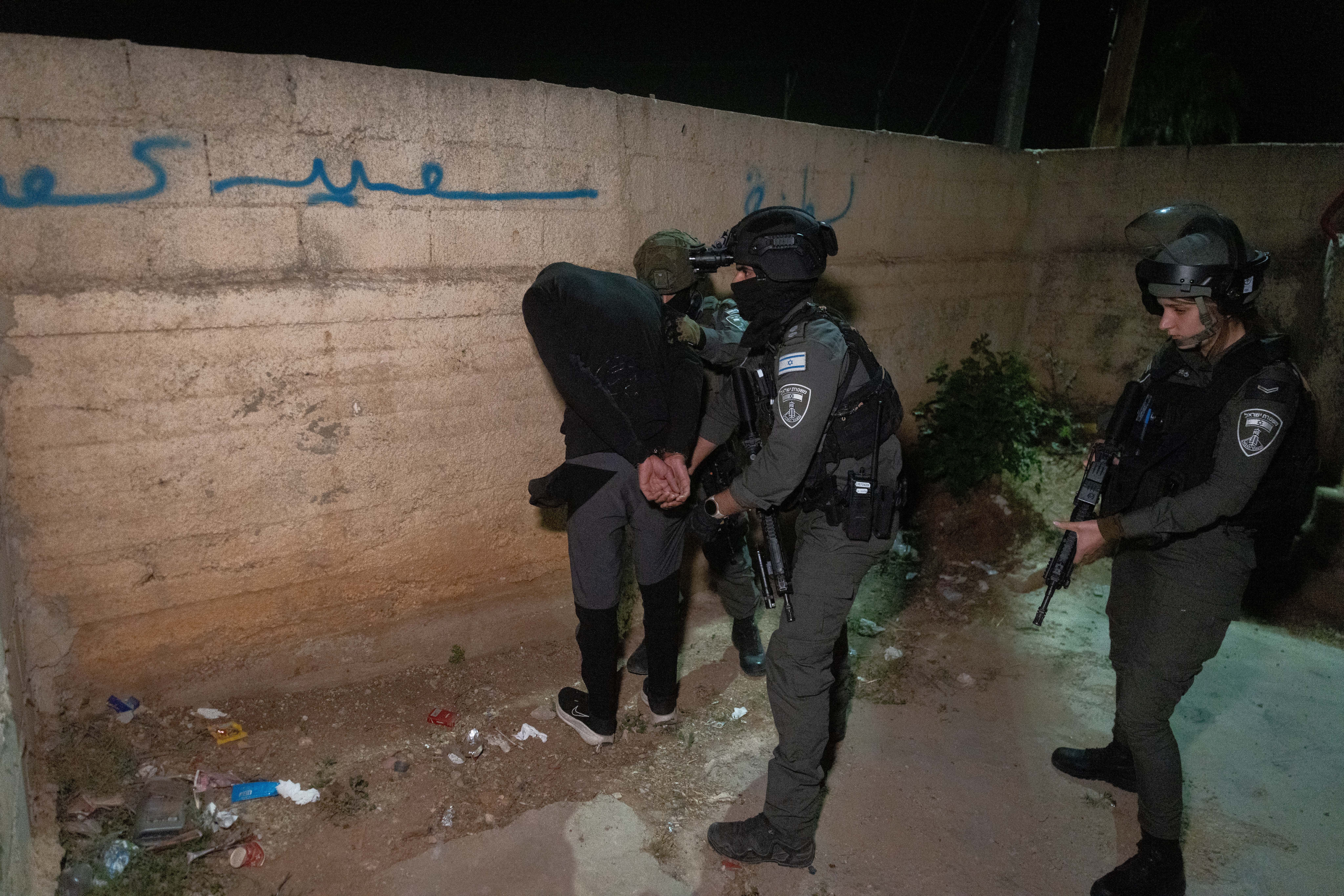 Border Police officers arrest a suspect during an operation in the village of al-Jib near Jerusalem, early May 14, 2026. (photo credit: CHAIM GOLDBERG/FLASH90)