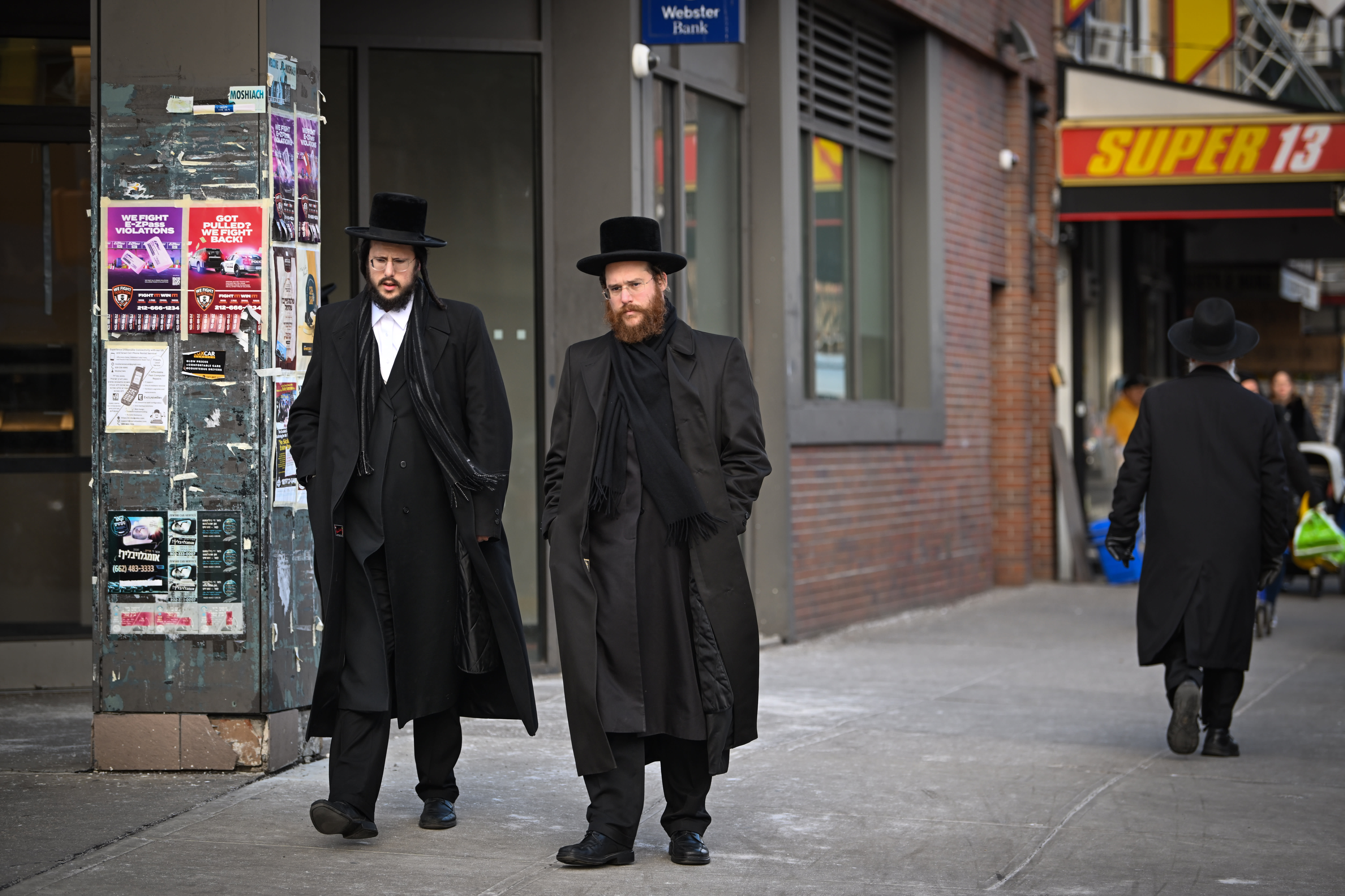 Ultra Orthodox Jews seen walking on a street in Borough Park neighborhood in the southwestern borough of Brooklyn, New York City on January 12, 2025. (photo credit: Arie Leib Abrams/Flash90)