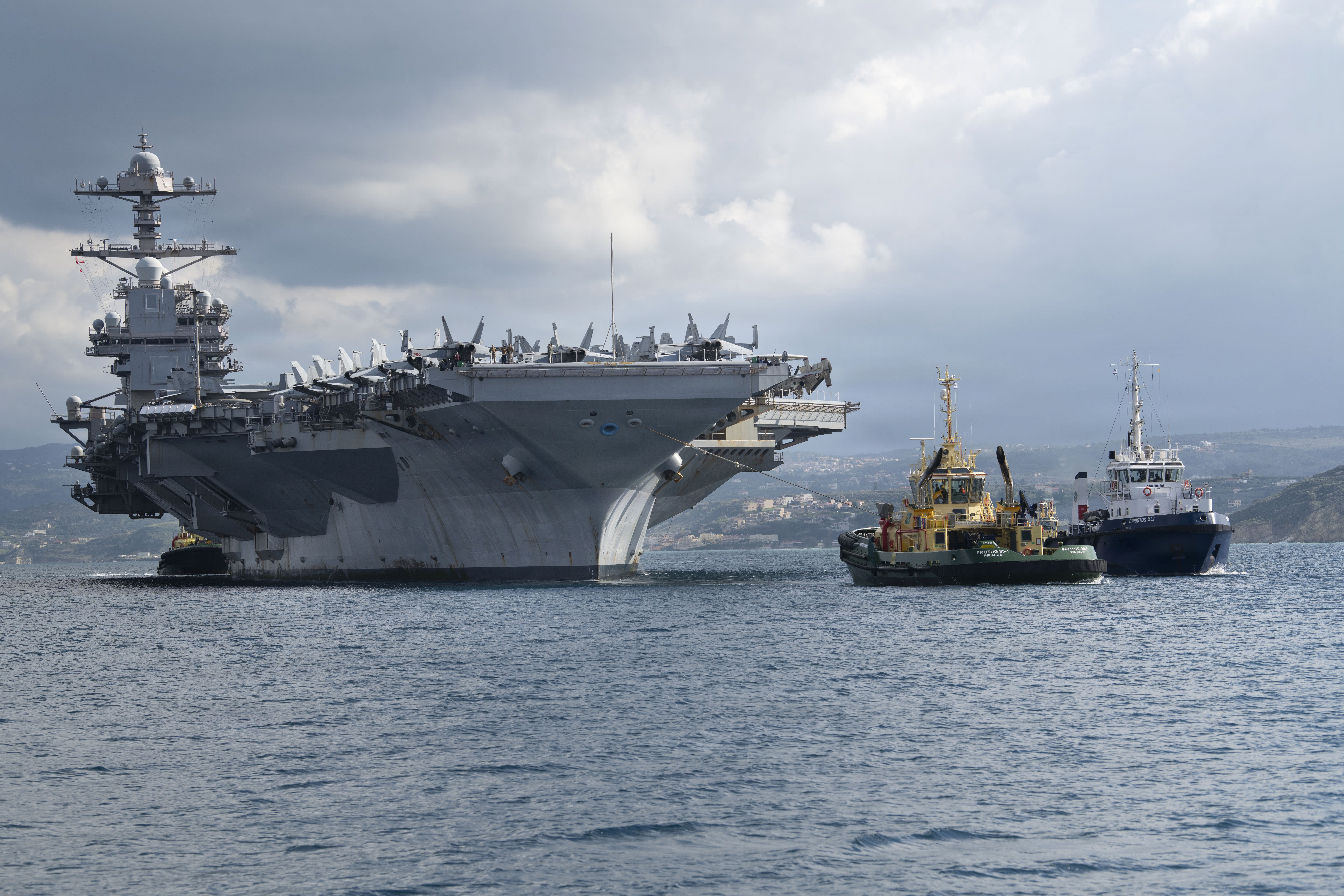 The world’s largest aircraft carrier, Ford-class aircraft carrier USS Gerald R. Ford (CVN 78) arrives at the NATO Marathi Pier Complex in Souda Bay, Crete, Greece, during a scheduled port visit on Feb. 23, 2026. (photo credit: US Navy photo by Mass Communication Specialist 3rd Class Hannah Donahue)