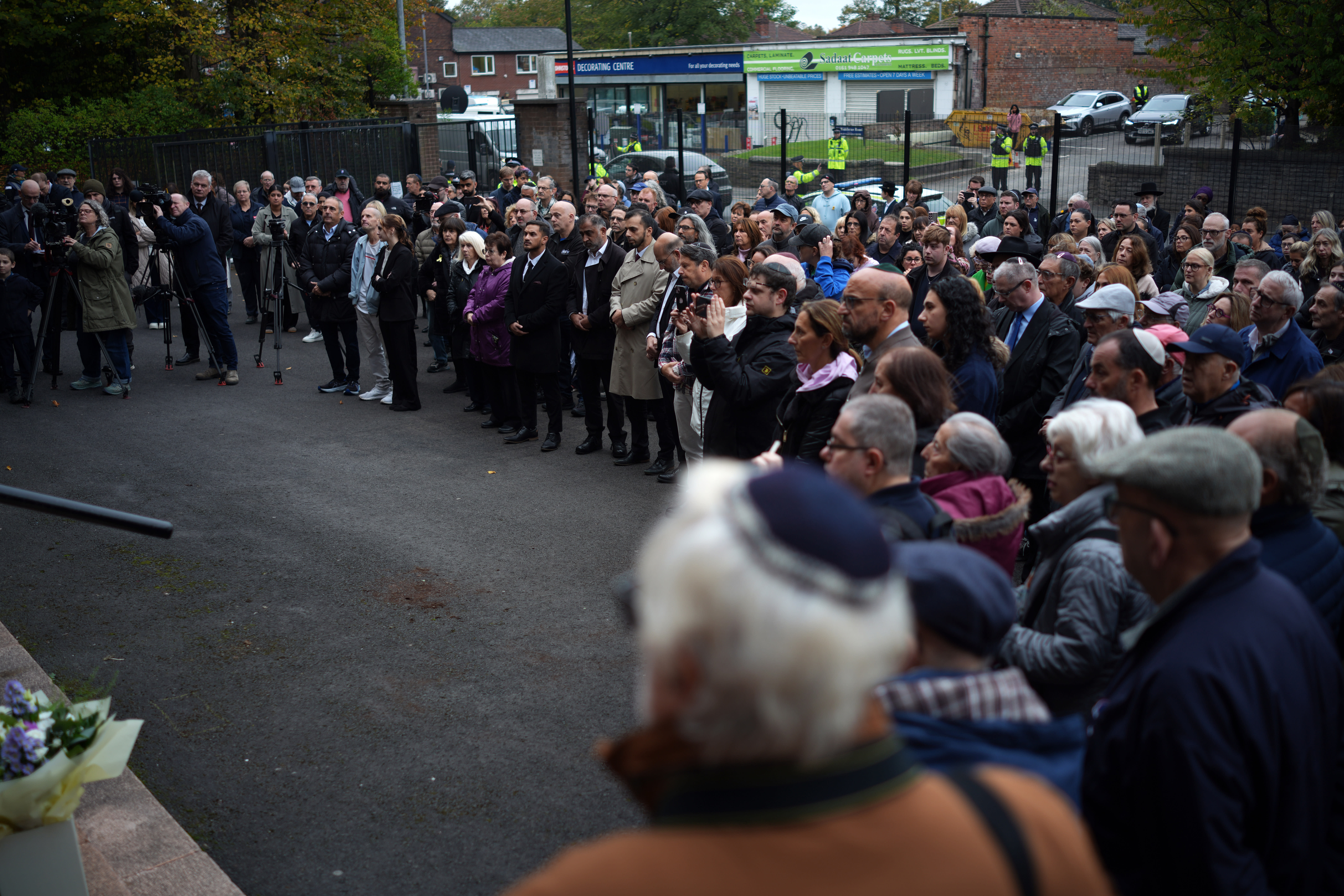 Members of the community gather for a vigil and one miniute silence at Heaton Park Hebrew Synagogue on October 09, 2025 in Manchester, England. (photo credit: Christopher Furlong/Getty Images)