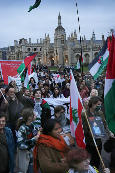  Pro-Palestinian demonstrators march past King