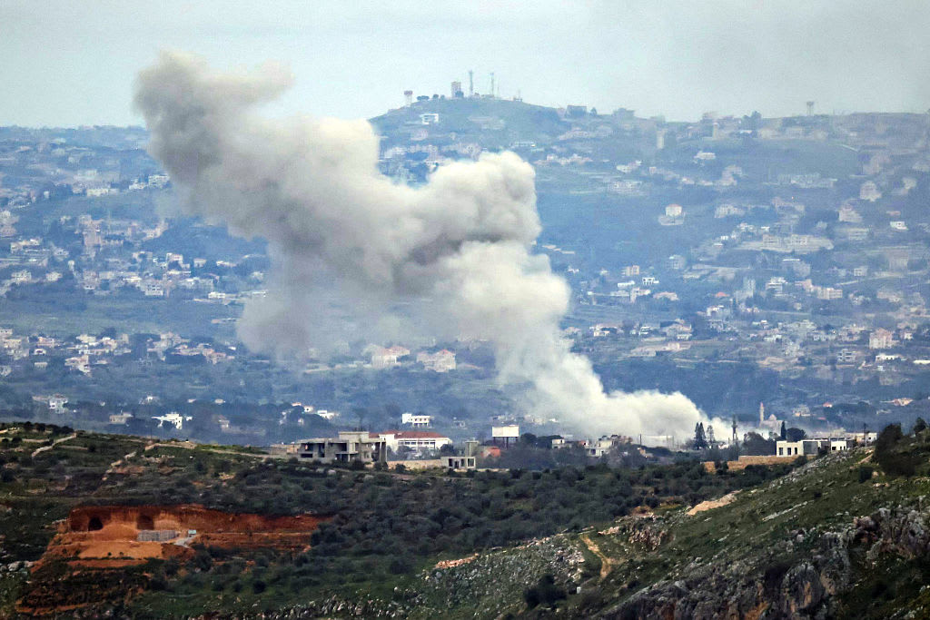 SMOKE RISES from the site of an Israeli air strike that targeted the southern Lebanese village of Dayr Seryan on March 25, 2026. (photo credit: AFP VIA GETTY IMAGES)