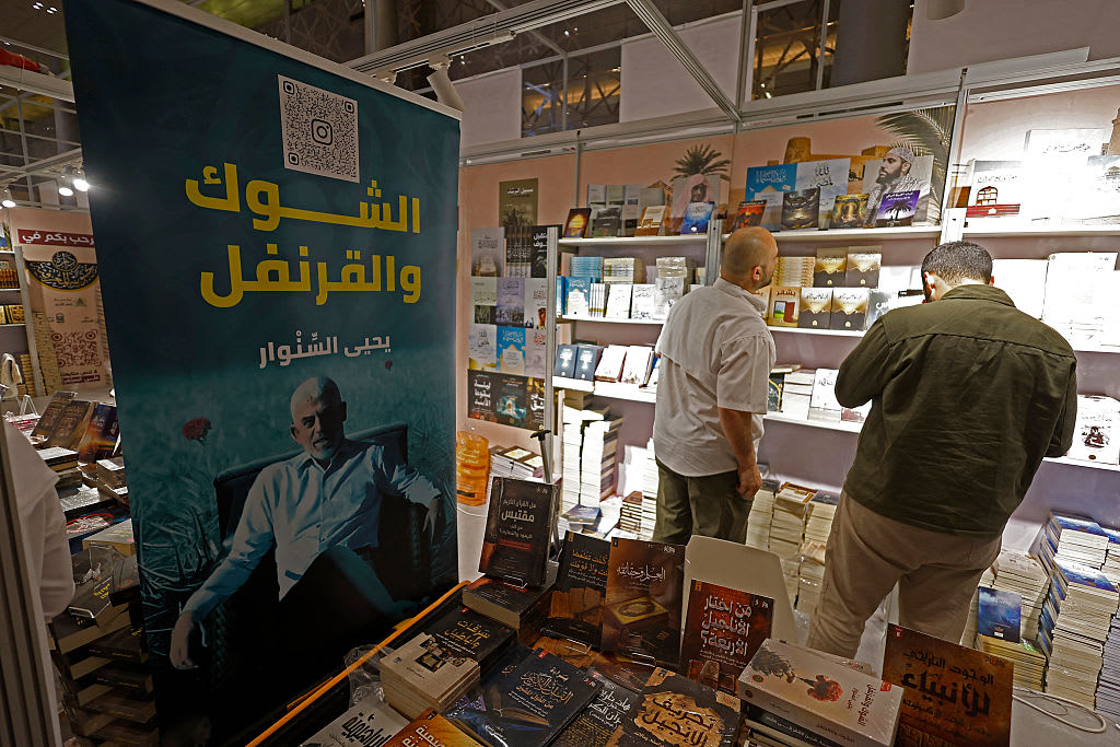 People visit the 35th edition of the Doha International Book Fair at the Qatari capital