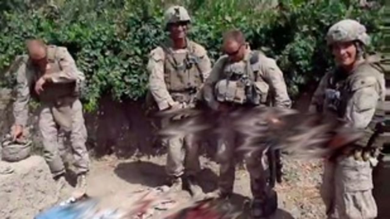 Screencap: Video of Marines urinated on Taliban corpses 311