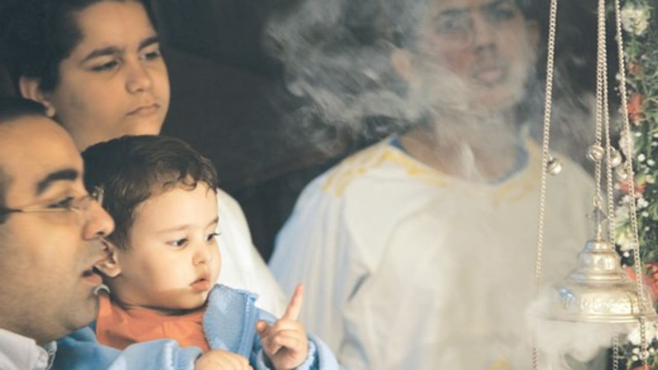 An Egyption Coptic father and son in a Cairo church