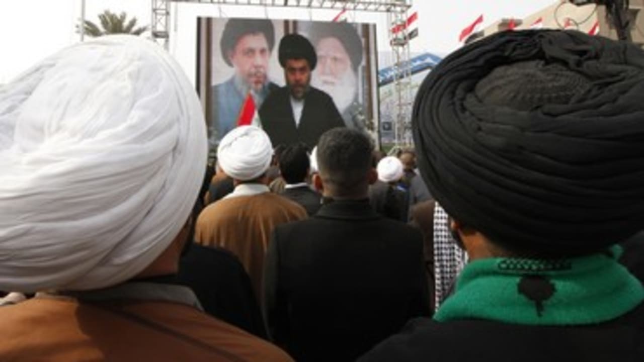 Supporters watch a Moqtada al-Sadr speech 370 (R)