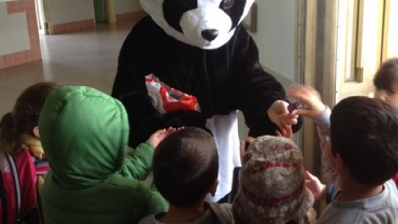 Children at Nitzan scool greeted by a Panda bear 370