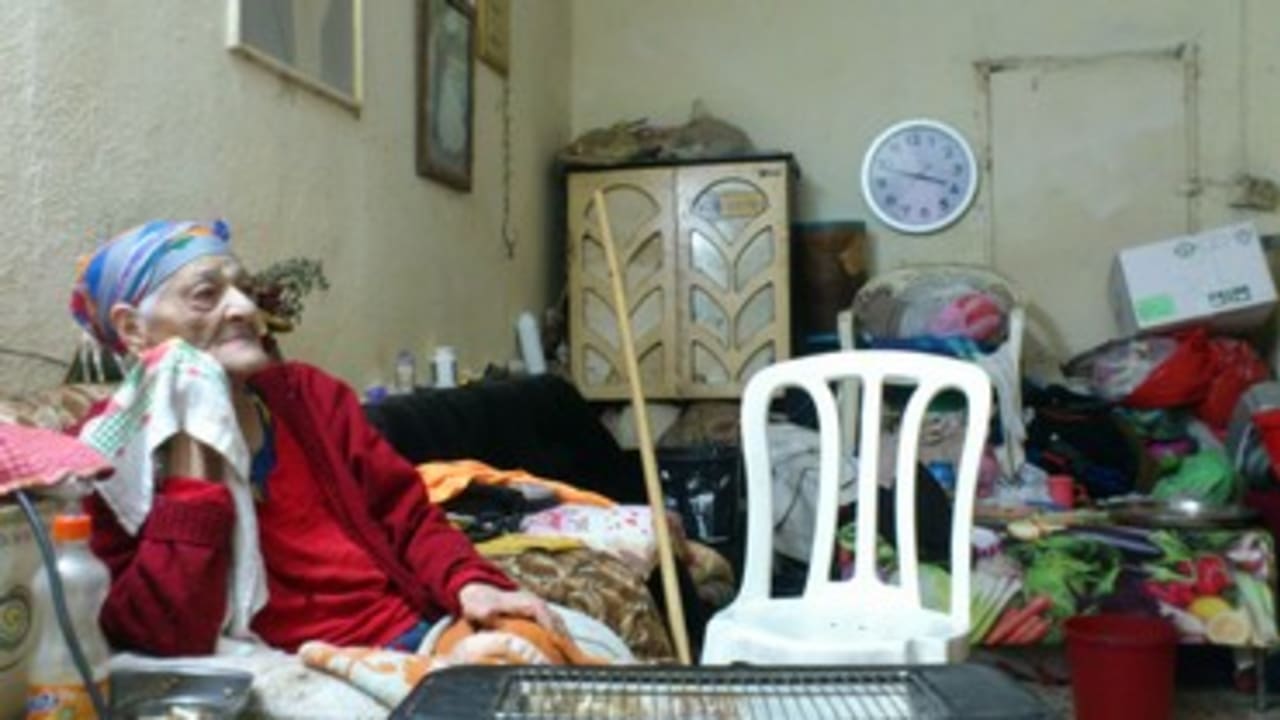 Eldery woman in her house in Argazim neighborhood 370