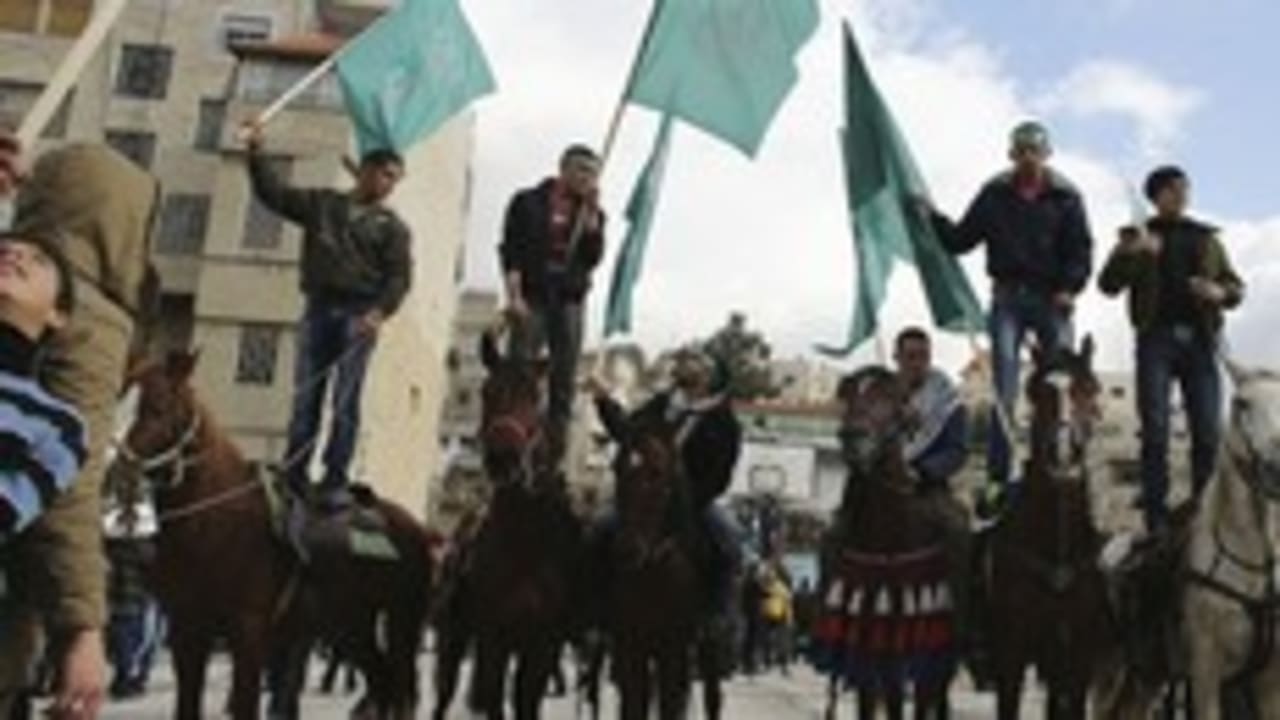 Hamas supporters rally in Hebron 300