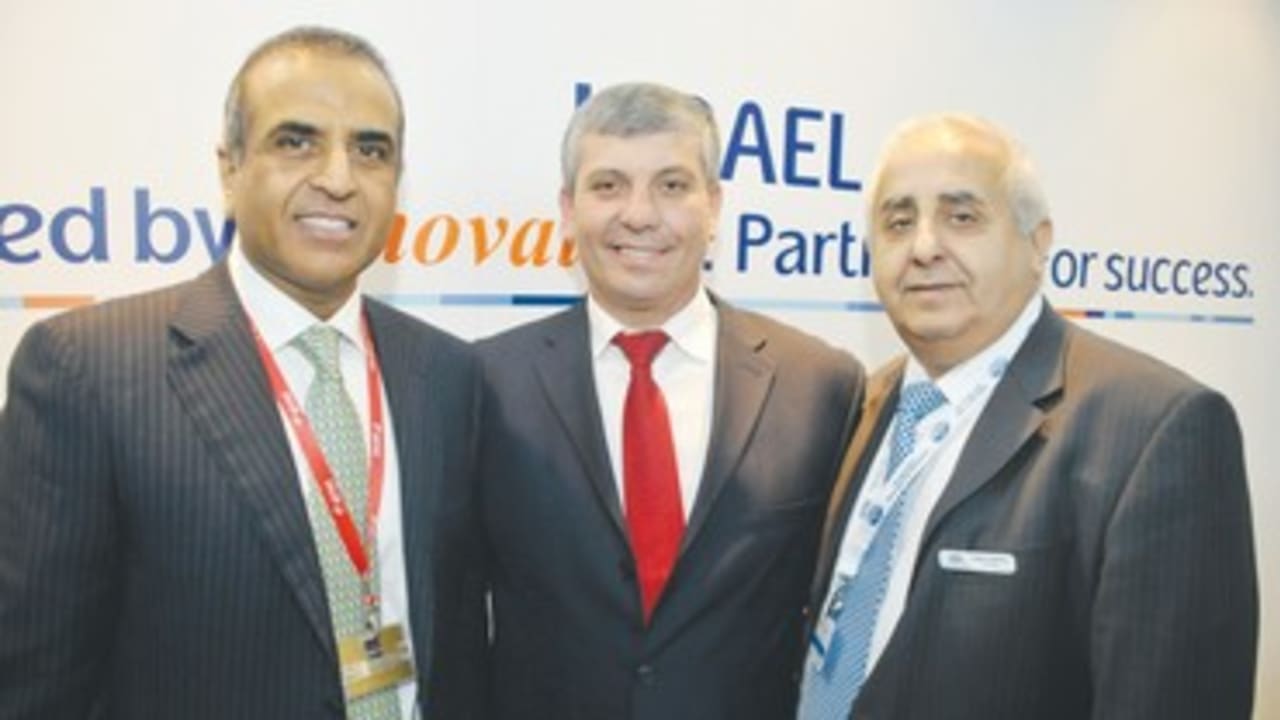 Simhon flanked by Mittal Gabai at World Mobile Congress 390