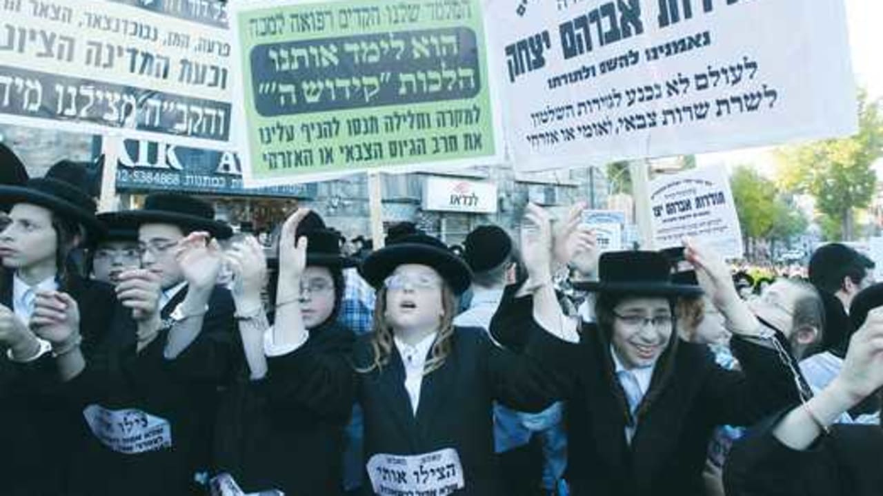 HAREDI YOUTH participate in a protest against the draft521