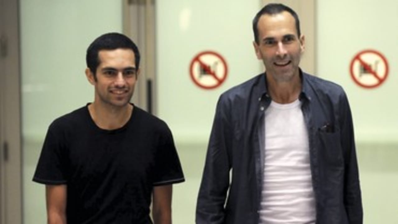 John Greyson (R) and Tarek Loubani arrive in Toronto