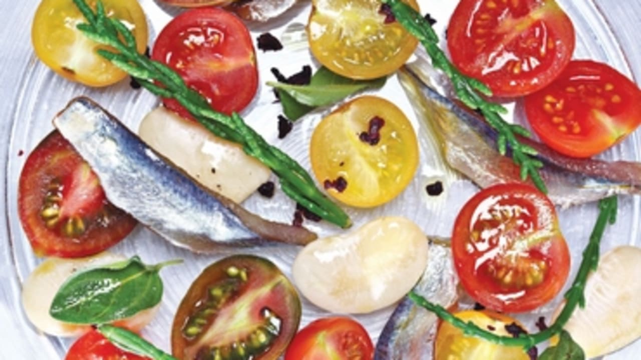Fresh anchovies and cherry tomatoes