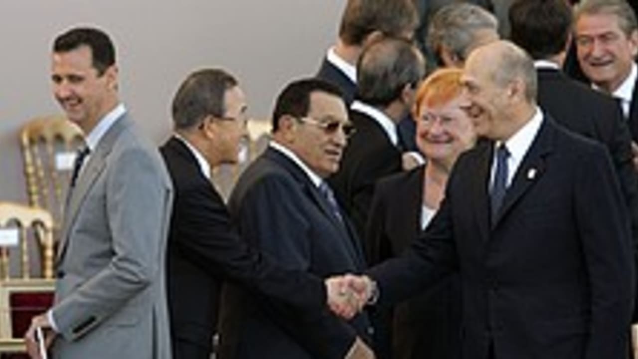 olmert behind assad 224.
