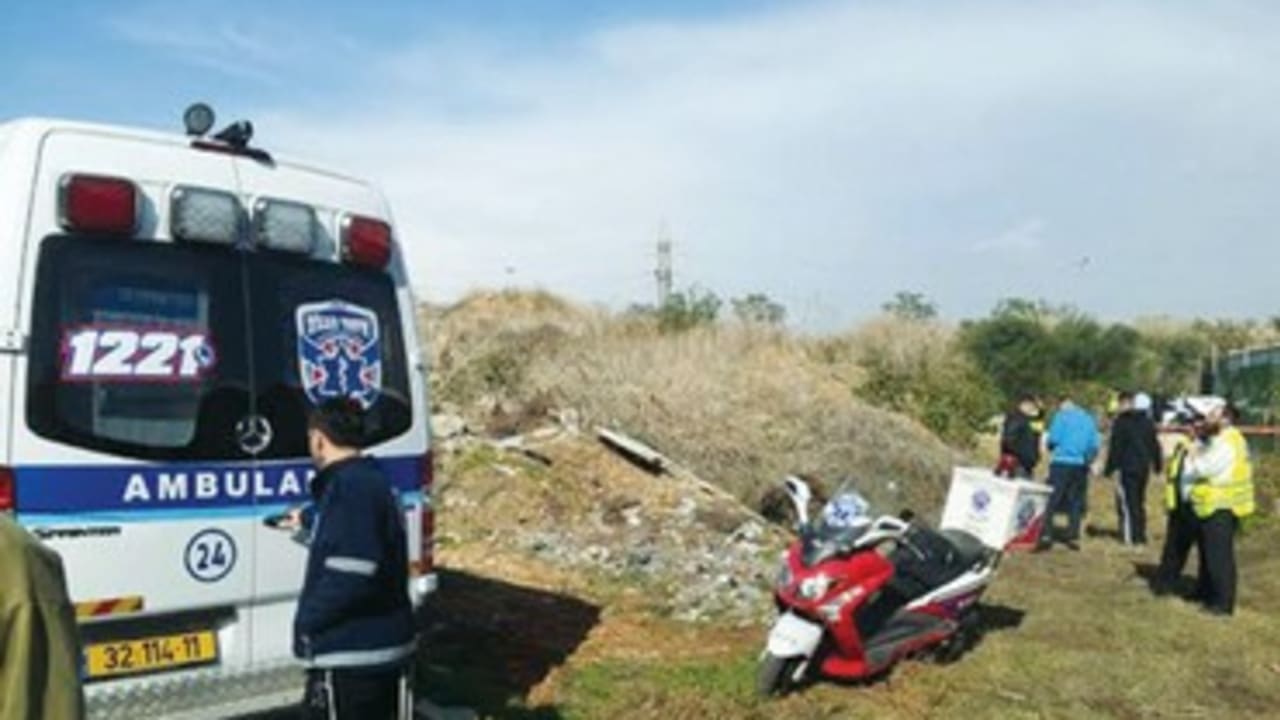 RECOVERY PERSONNEL are shown at the site in Bnei Brak
