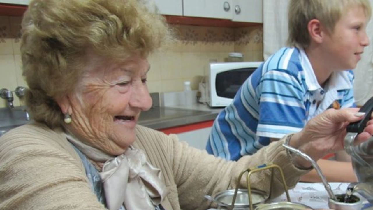 ESTHER AZERETZKY, 84, pours a mug of mate, the Argentine national hot drink.