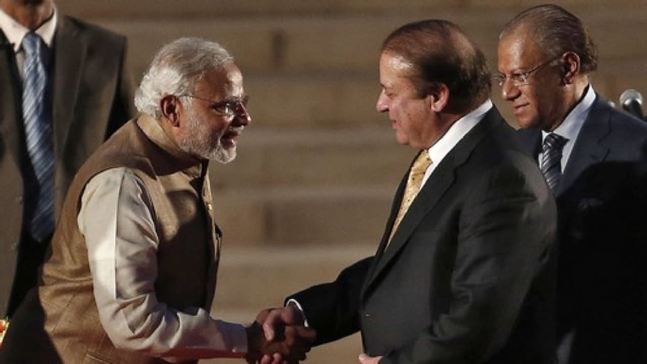 India's Prime Minister Narendra Modi (L) is greeted by his Pakistani counterpart Nawaz Sharif after Modi took the oath of office at the presidential palace in New Delhi May 26, 2014