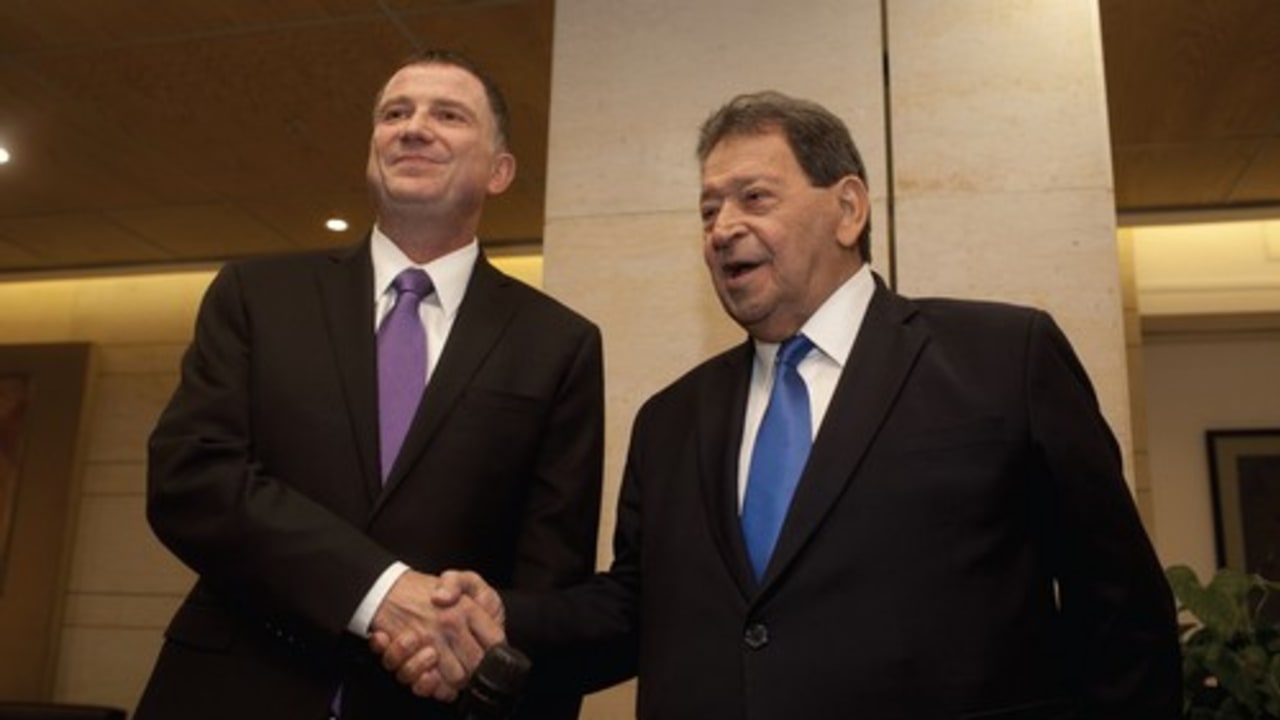 Before the fall: Binyamin Ben-Eliezer (right) presents his candidacy for the presidency to Knesset Speaker Yuli Edelstein on May 27